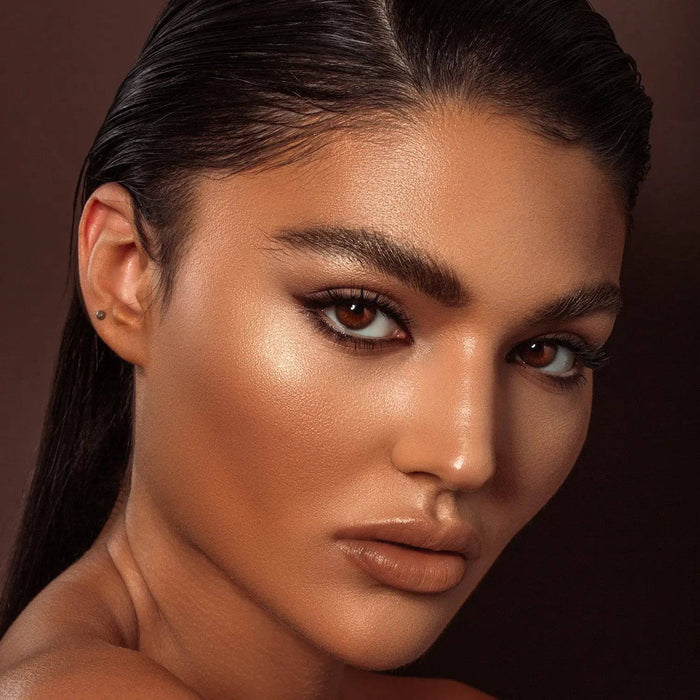 Mini Bronze and Glow Cheek Palette model look on a brown background.