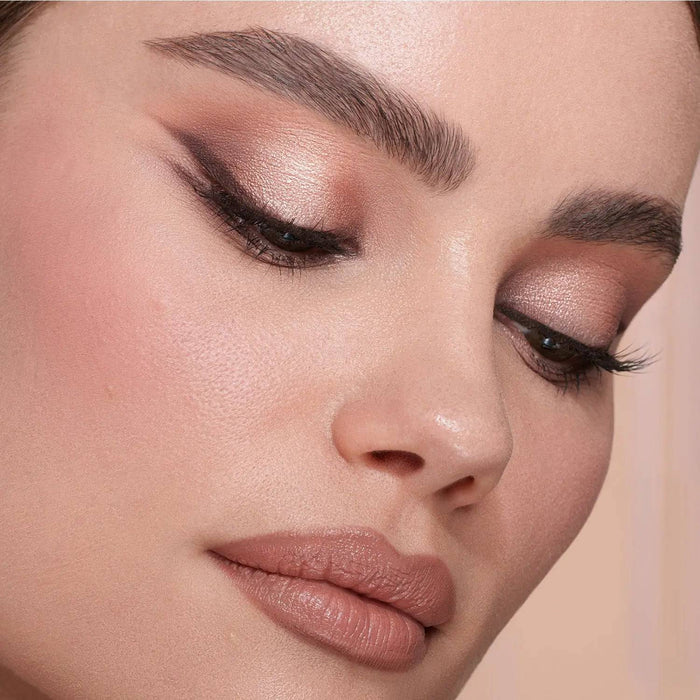 My Mini Dream Glow Blush model look on a light pink background.