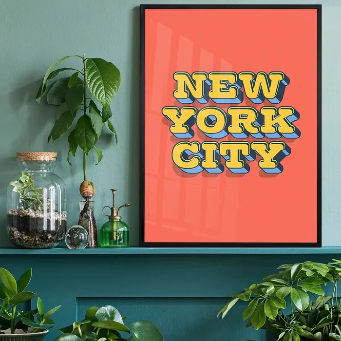 New York City Typography Print, quote print black framed on a living room shelf