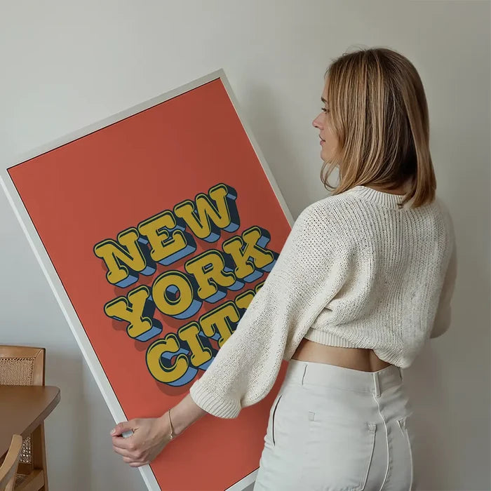 New York City Typography Print held up against a living room wall