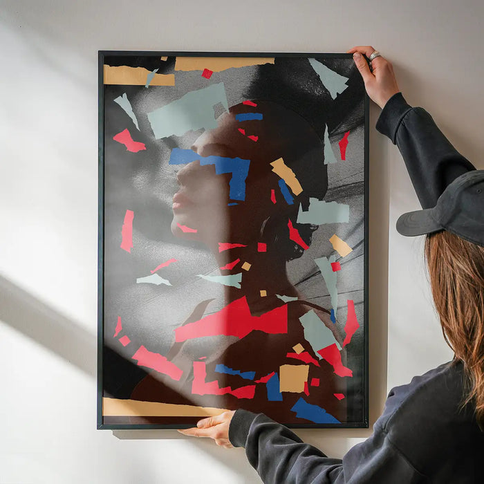 Paper Portrait 2 Print being hung on a wall in a black frame