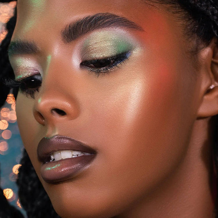 Pastel Plexi Glow Highlighter model look on a sparkly background.