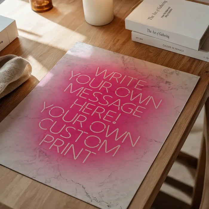 Pink Neon Centered White Print, personalised print unframed on a home office desk