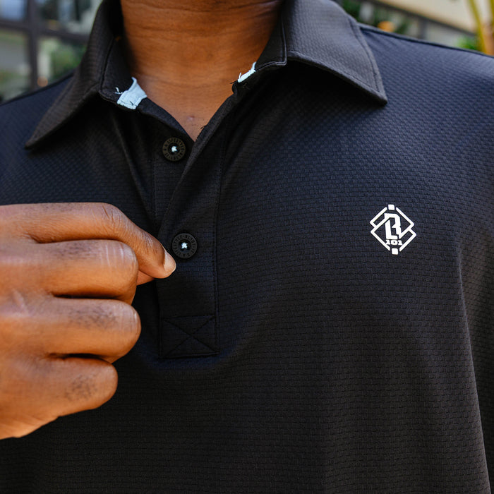 Adult model wearing black Pro Series Elite polo