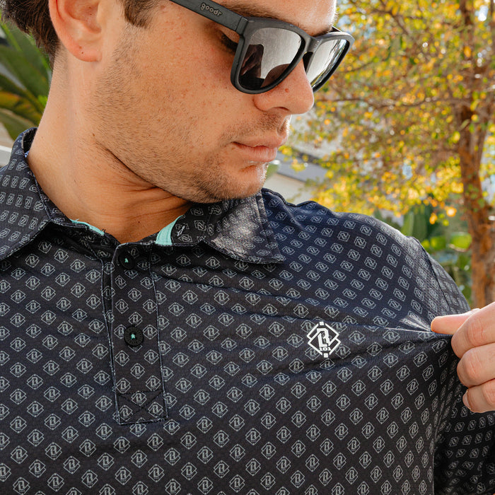 Adult model wearing black and gray Pro Series Elite polo