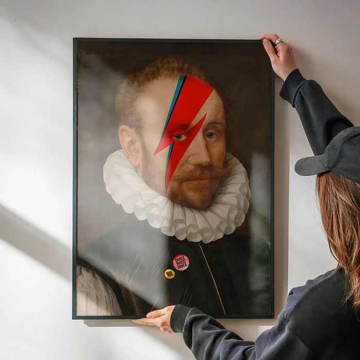 Rebel Bowie Print being hung on a wall in a black frame