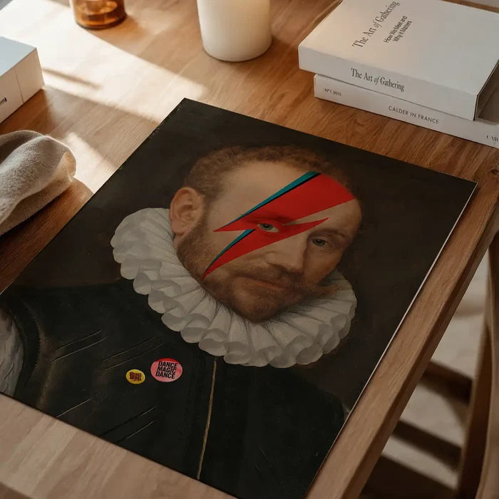 Rebel Bowie Print, quirky altered art print unframed on a home office desk
