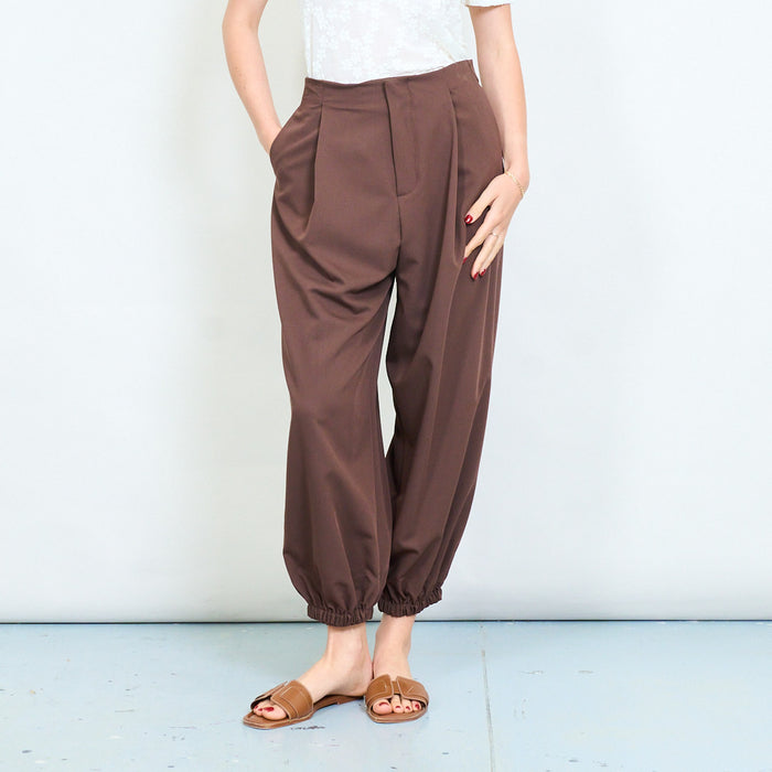 Relaxed tapered leg trousers with elastic cuff hem and clean waistband detail wholesale