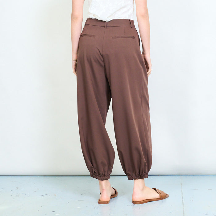 Relaxed tapered leg trousers with elastic cuff hem and clean waistband detail wholesale