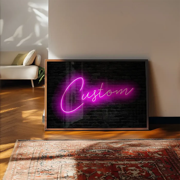 Retro Script Neon Print framed, leaning on a wooden floor beside a rug