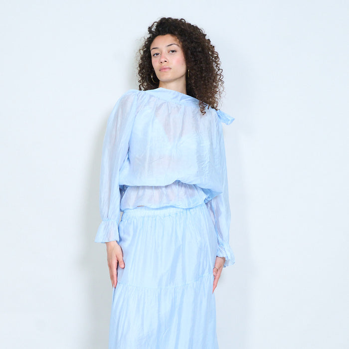 Sheer layered blouse with side tie neckline and elastic hem detail wholesale