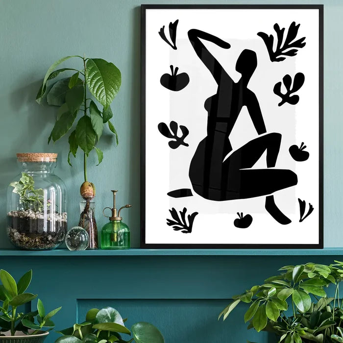Sitting Woman Black and White Painting Print black framed on a living room shelf