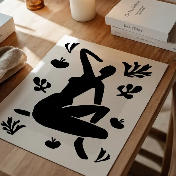 Sitting Woman Black and White Painting Print unframed on a home office desk