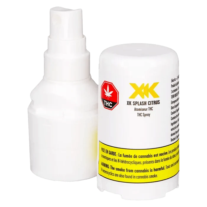 Front-facing close-up of the XK Splash Citrus 3.33 g white spray bottle and its detached cap showing label text, THC symbol, and yellow warning band.