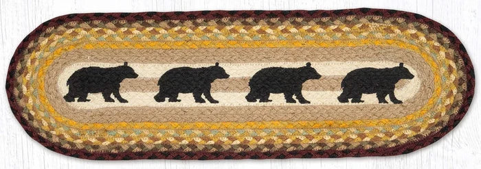 Oval stair tread with a cabin bear design, featuring silhouettes of bears in a repeating pattern, in colors burgundy, black, and sage on a natural jute background.