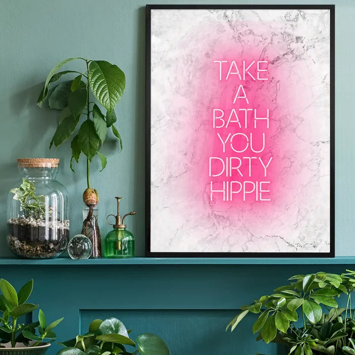 Take A Bath Hippie White Print, typography print black framed on a living room shelf