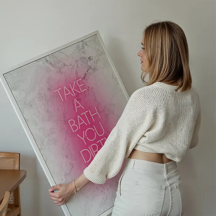 Take A Bath Hippie White Print held up against a living room wall