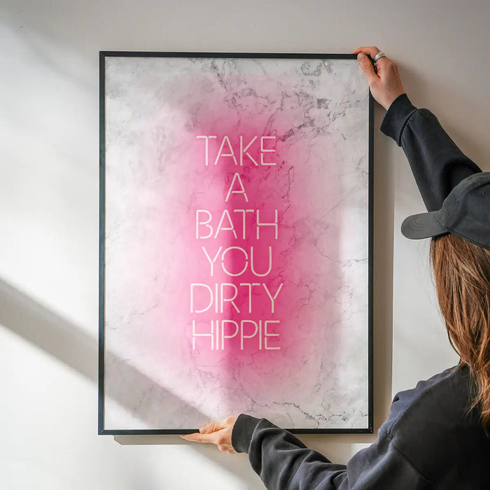 Take A Bath Hippie White Print being hung on a wall in a black frame