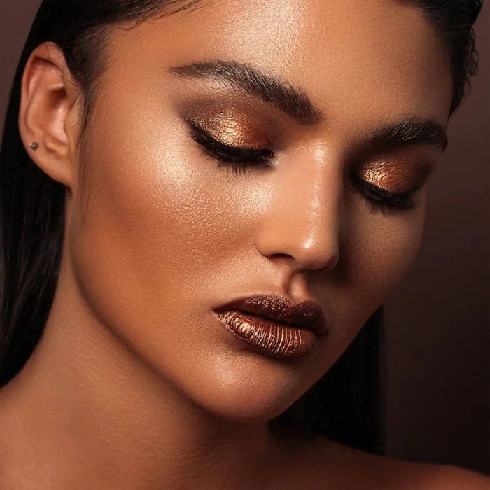 Tan Palette model look on a dark brown background.