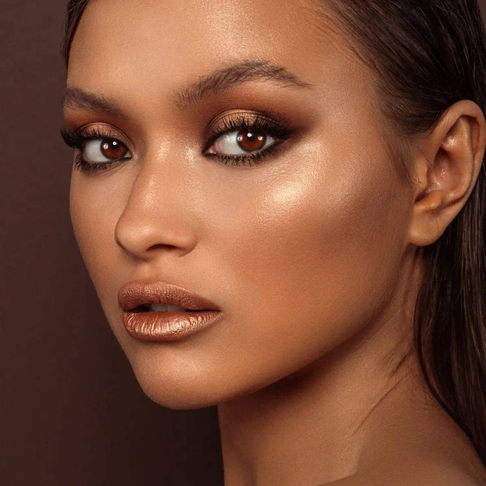 Tan Palette model look on a dark brown background.