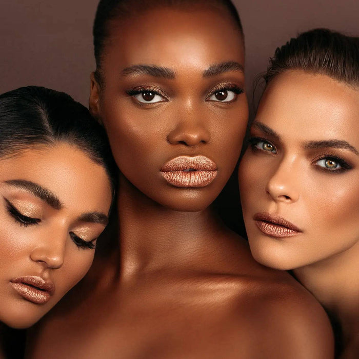 Tan Palette model looks with three different skin tones on a dark brown background.