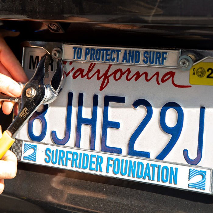 To Protect and Surf Chrome License Plate Frame