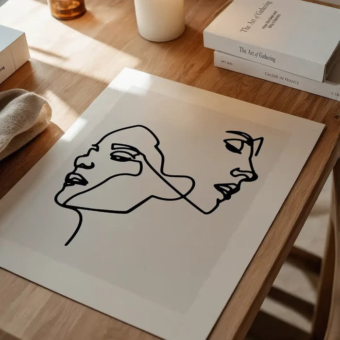Two Faces Study Line Art Print unframed on a home office desk